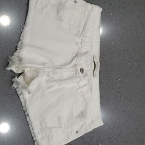 White denim shorts. Raw hem